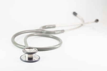 Green stethoscop on white backgroundの写真素材