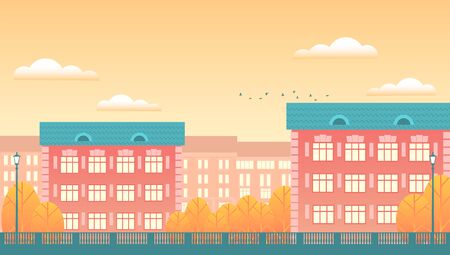 Background of the autumn city. Residential buildings, yellow trees, patterned fencing, clouds in the sky. Vector flat illustration in the form of a banner.のイラスト素材