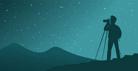 A man tourist photographs the starry skyのイラスト素材