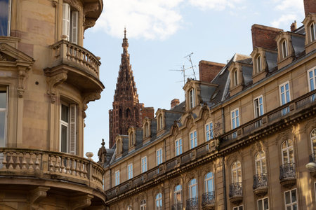 Strasbourg, France. October 9, 2022. Beautiful city ancient buildings and cathedral. View of building facade with windows and sculpture. summer dayのeditorial素材