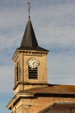 Verdun, France. December 15, 2022. Ancient church in France with spirit and clock. stone building...