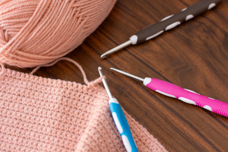 Hooks and threads for crocheting. Hobbies, creativity and handicrafts. Home leisure. Photo view from aboveの写真素材