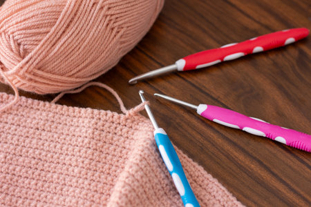 Hooks and threads for crocheting. Hobbies, creativity and handicrafts. Home leisure. Photo view from aboveの写真素材