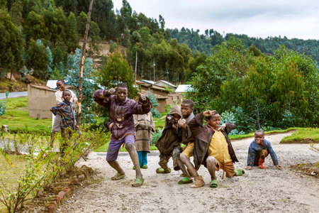 Byumba, Rwanda, Africa - September 6, 2015: Unidentified children. The faces of Africa. The children who are understood as poor from their old clothes and shoes pose happily.のeditorial素材