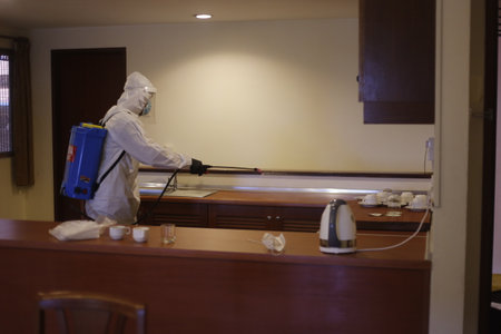 Teluk Kemang, Malaysia - April 24, 2020: Disaster Operation conducted by the Malaysian Fire and Rescue Department's Hazmat Special Forces at the Covid-19 Quarantine Interim Center in a hotel.のeditorial素材