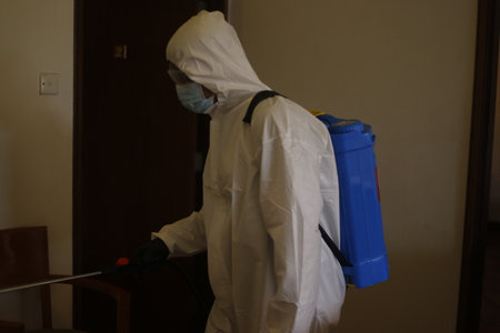 Teluk Kemang, Malaysia - April 24, 2020: Disaster Operation conducted by the Malaysian Fire and Rescue Department's Hazmat Special Forces at the Covid-19 Quarantine Interim Center in a hotel.のeditorial素材