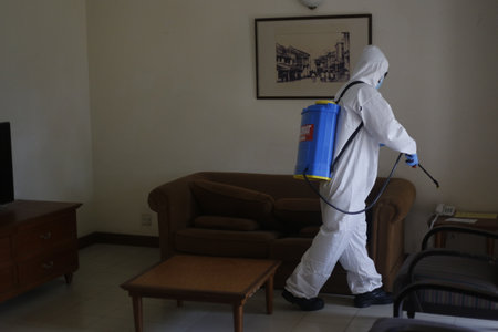 Teluk Kemang, Malaysia - April 24, 2020: Disaster Operation conducted by the Malaysian Fire and Rescue Department's Hazmat Special Forces at the Covid-19 Quarantine Interim Center in a hotel.のeditorial素材