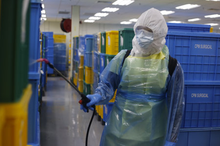 Seremban, November 15, 2020. Sanitation Operations at Top Glover Factory were carried out by Hazmat Special Team due to the increase in Covid-19 cases in the factory.のeditorial素材