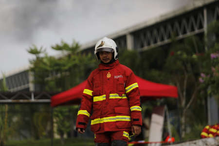 NILAI, MALAYSIA - 12 APRIL 2021: Malaysian firefighters try to put out a large fire that destroyed a factory in NILAI, NEGERI SEMBILAN.のeditorial素材