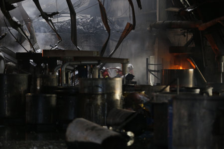 NILAI, MALAYSIA - 12 APRIL 2021: Malaysian firefighters try to put out a large fire that destroyed a factory in NILAI, NEGERI SEMBILAN.のeditorial素材