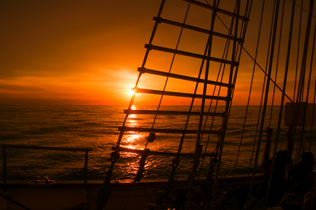 sunset on the sailing shipの写真素材