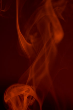 Red smoke on black background. Abstract background. Texture of fire.の写真素材