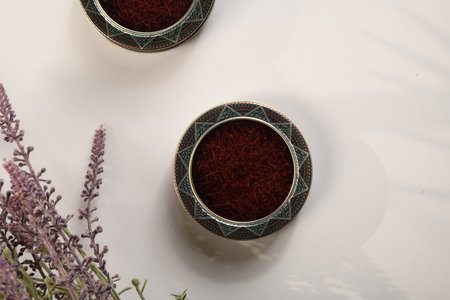 Dried saffron and crocus flowers on table, closeup