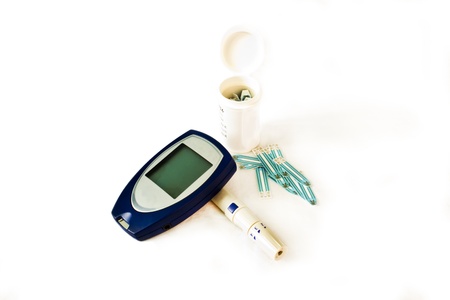Diabetes testing kit  Glucometer  over a white backgroundの写真素材