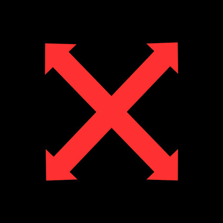 A vibrant red X symbol with outward-pointing arrows on all four ends against a solid black backdrop.の写真素材