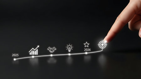 A finger touches a glowing digital line with icons representing business growth, innovation, and success on a dark surface.の素材