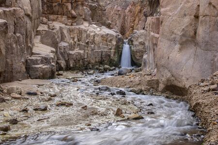 The waterfall and running river across the sandstone rocksの写真素材