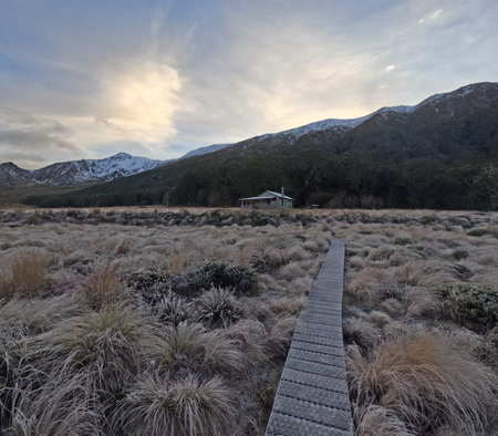Green Lake Hut, nestled in Fiordland National Park, is a remote backcountry hut offering a peaceful retreat. Surrounded by lush forests and overlooking the pristine Green Lake, itâs a perfect destination for hikers and nature lovers.の写真素材