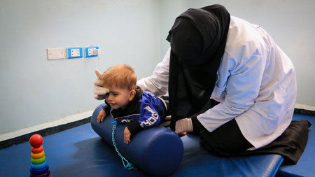 Aleppo, Syria 21 February 2020:
A doctor treats the child with natural exercises. Physical...