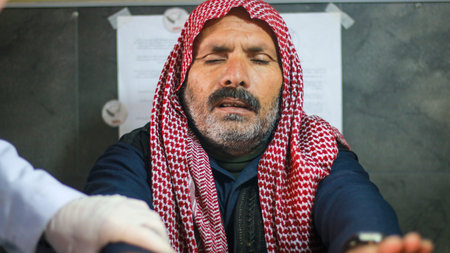 Aleppo, Syria 21 February 2020: Elderly people are in pain in the hospital. Patient at the...