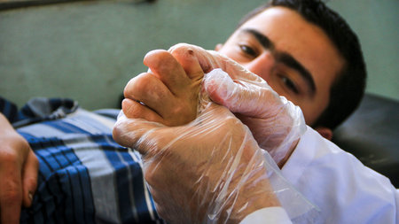 Aleppo, Syria 21 February 2020: Elderly people are in pain in the hospital. Patient at the...