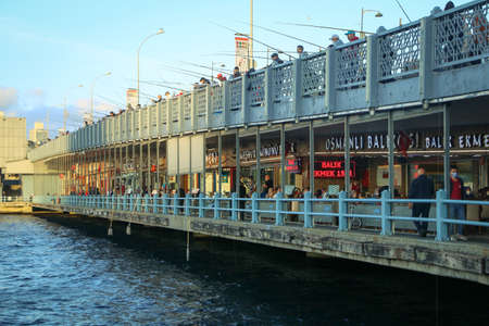 Fishermen standing on top of the bridge overlooking the sea. fishingのeditorial素材