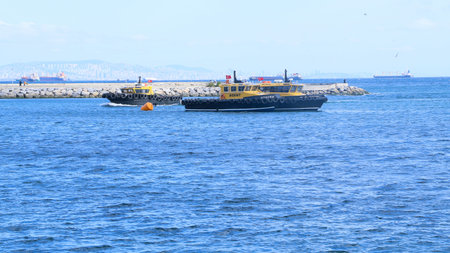 A group of ships dock at the side of the sea. A ship making its way in the middle of the sea
Istanbul, Turkey 20 October 2020のeditorial素材