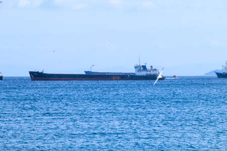A group of ships dock at the side of the sea. A ship making its way in the middle of the sea
Istanbul, Turkey 20 October 2020のeditorial素材