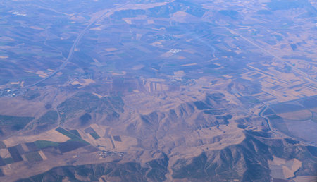 Veiw from plane window of clouds covering mountains.
Veiw above the clouds