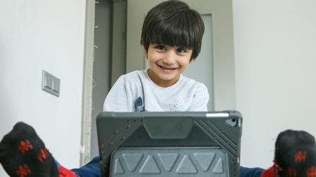 Distance Learning, Cute child learning on tablet. sweet smiling from a child watching tablet.