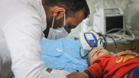 A mother afraid for her sick son, a mother holding her sonâs hand.
Aleppo, Syria 01 October 2020のeditorial素材