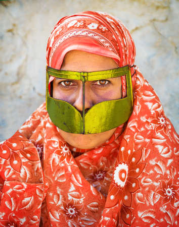 A bandari woman wearing a traditional mask called the burqa at Salakh, Qeshm Island, Hormozgan Province of Iran.のeditorial素材