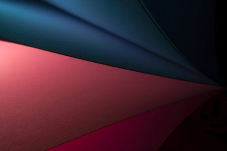 Colorful abstract background of curved sheets of paper in red and blueの写真素材