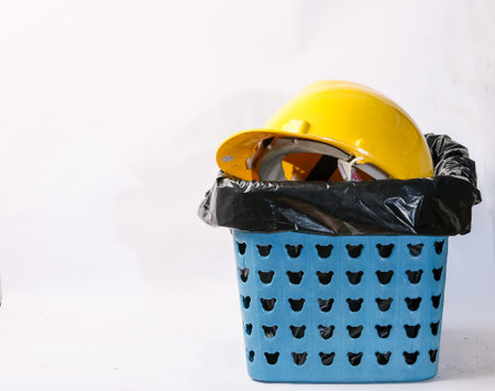 Safety helmet and dustbin isolated on white background with clipping path.の写真素材