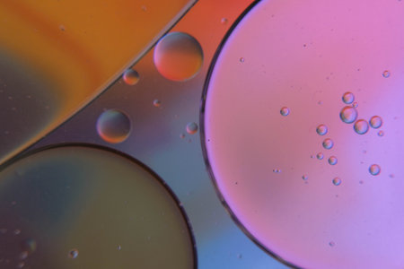 colorful abstract background with oil bubbles on water surface, macro shot