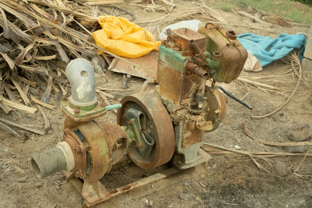 Vintage old rotary grinder on the ground, Thailand.