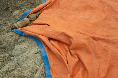 Close-up of an orange cloth on a construction site in Thailand