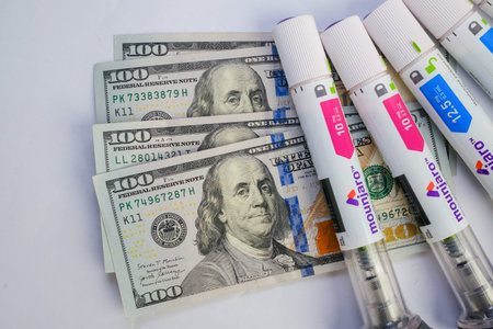 Basra, Iraq - August 5, 2025: Mounjaro Pens and Money Representing High Cost of Medicine
