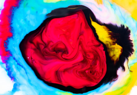 Abstract colorful swirl with vibrant red, blue, yellow, and black hues.の写真素材