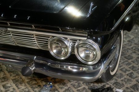 Close-up of a classic black Chevrolet car front with chrome details and headlightsのeditorial素材