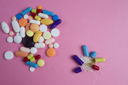 macro photo of open capsule and pills