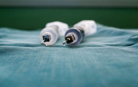 macro photo of water drop on the tip of needle