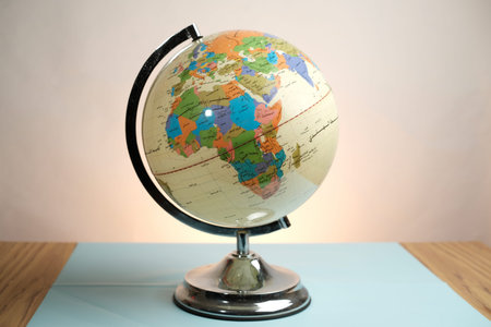 Basra, Iraq- March 04, 2026: Educational World Globe With Arabic Script Labels On Table Surface