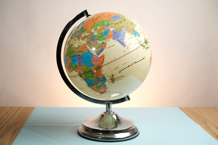 Basra, Iraq- March 04, 2026: Educational World Globe With Arabic Script Labels On Table Surfaceのeditorial素材