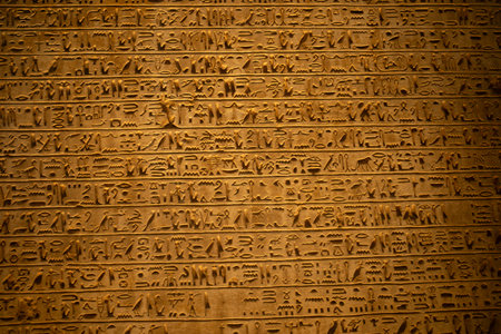 Cairo, Egypt- February 01, 2026: Ancient Egyptian Hieroglyphic Inscriptions Carved into Stone Wall...