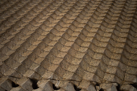 Cairo, Egypt- February 01, 2026: Textured Granite Water Feature Mimicking Cascading Ripples at Grand Museumのeditorial素材