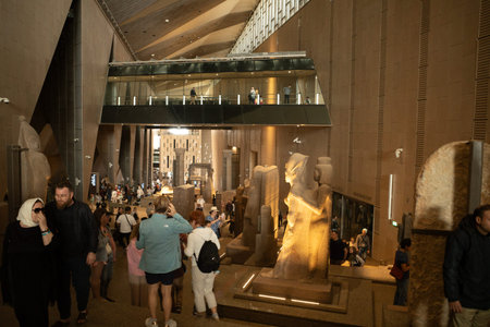 Cairo, Egypt- February 01, 2026: Ancient Stone Statue of Pharaoh Akhenaten and Nefertiti at Grand...