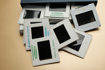 Vintage Photography Film Slides Scattered On Table Near Storage Box