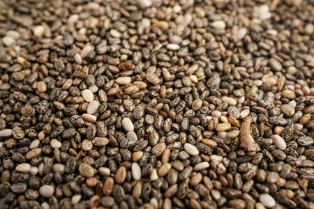 Heap of Mixed Black and White Chia Seeds on White Background