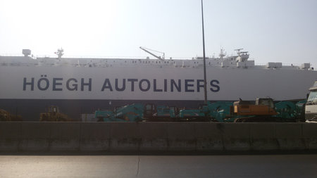Cargo terminal for loading bulk cargo of iron ore by ship cranes and grabs.の写真素材